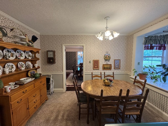 1001 Hall St, Bainbridge, GA 39819 - dining area with ornamental molding, wallpapered walls, a chandelier, a textured ceiling, and light colored carpet