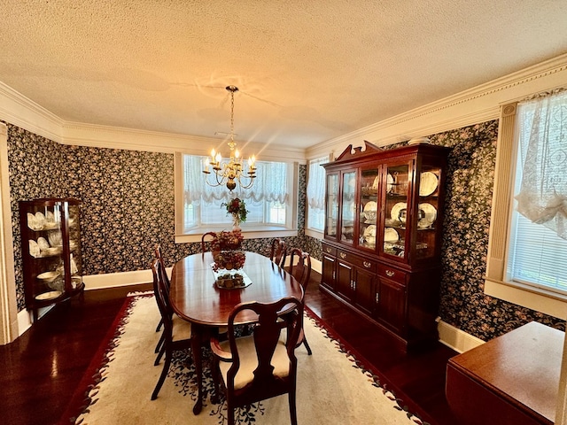1001 Hall St, Bainbridge, GA 39819 - dining space with a textured ceiling, a chandelier, wood finished floors, crown molding, and wallpapered walls