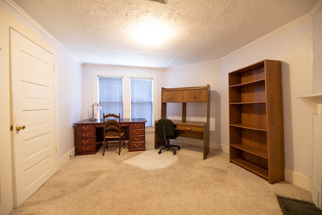 office area featuring a textured ceiling, ornamental molding, baseboards, and light carpet