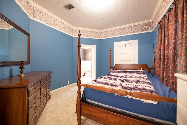 bedroom with carpet flooring, crown molding, and visible vents