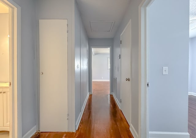 corridor featuring hardwood / wood-style floors