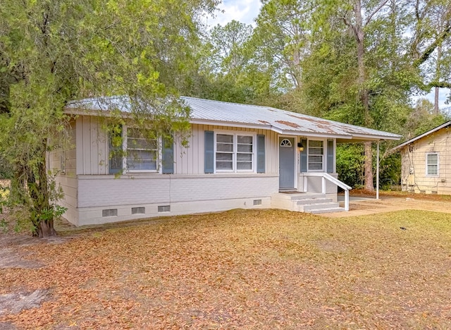 ranch-style home with a front lawn