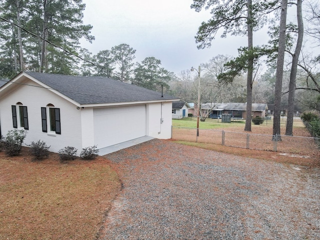 view of side of property with a garage