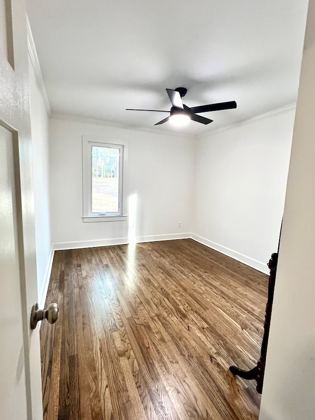 unfurnished room featuring crown molding, wood-type flooring, and ceiling fan