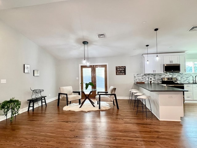 dining area featuring french doors and dark hardwood / wood-style floors