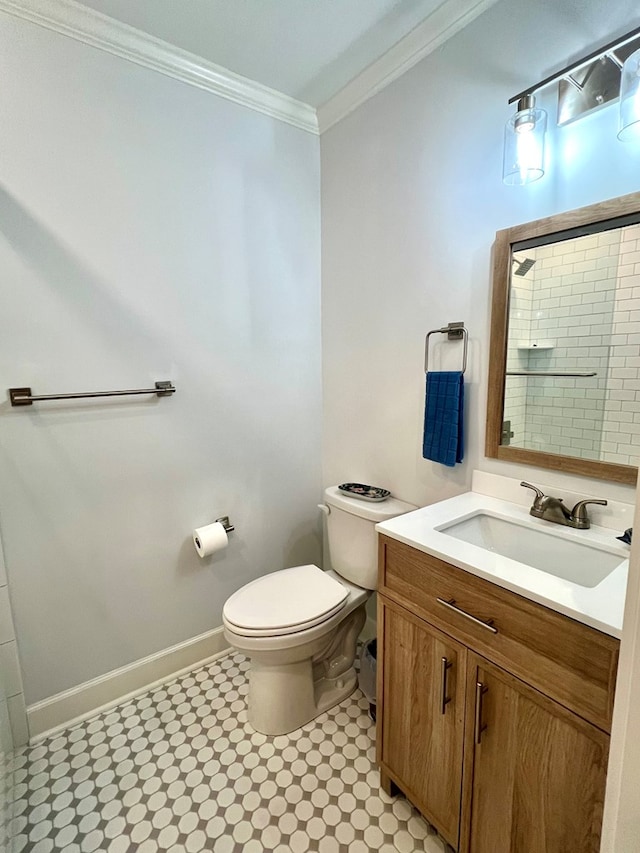 bathroom with walk in shower, ornamental molding, toilet, and vanity