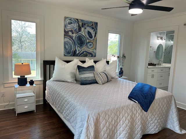 bedroom featuring ornamental molding, connected bathroom, ceiling fan, and dark hardwood / wood-style flooring