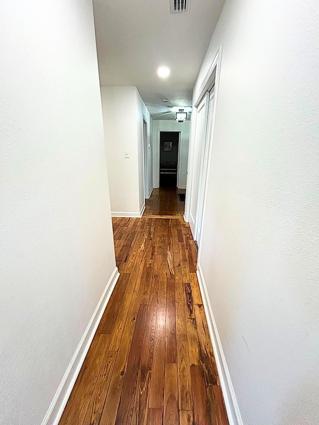 hall featuring dark hardwood / wood-style floors