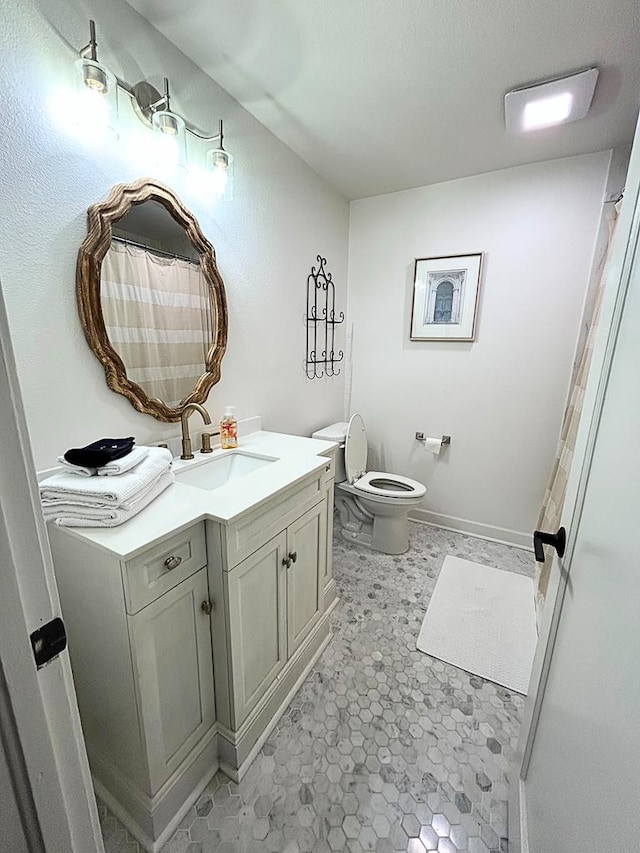 bathroom with vanity and toilet