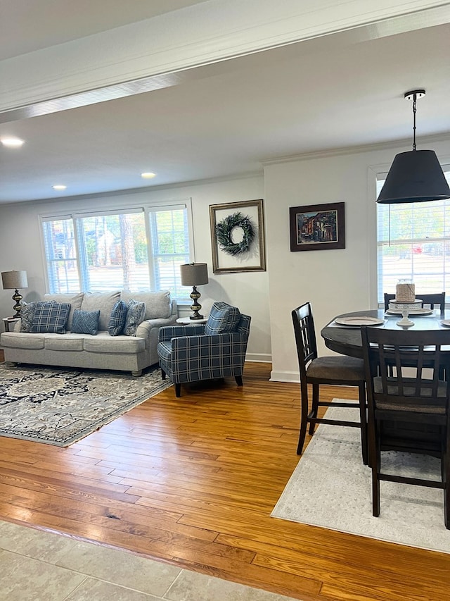 living room featuring hardwood / wood-style floors and ornamental molding