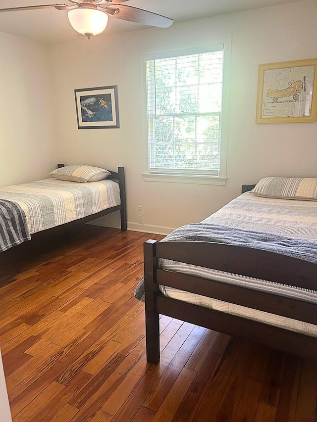 bedroom featuring hardwood / wood-style flooring and ceiling fan