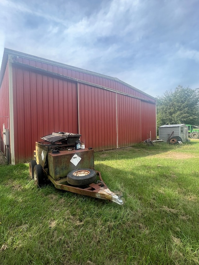 view of yard featuring an outbuilding and a pole building