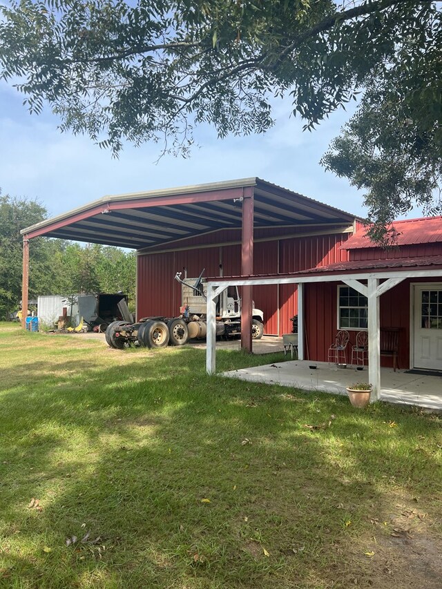 view of parking with an outbuilding