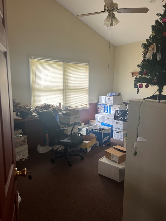 home office featuring carpet, vaulted ceiling, and a ceiling fan