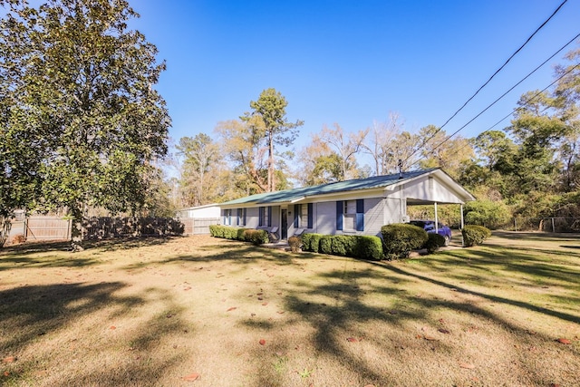 view of side of home with a lawn and covered porch