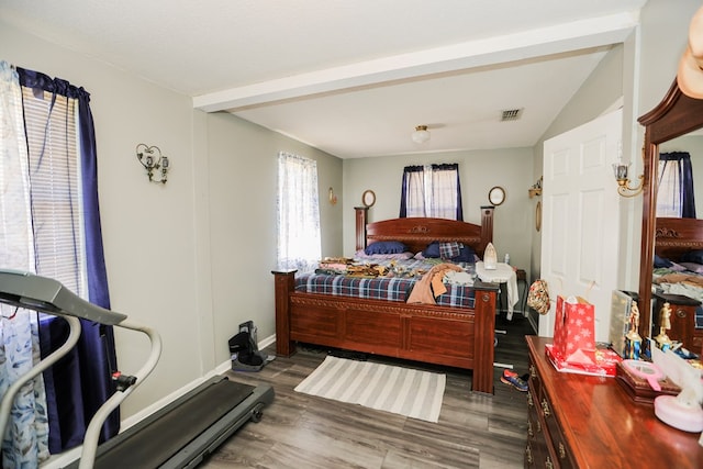 bedroom with dark hardwood / wood-style flooring