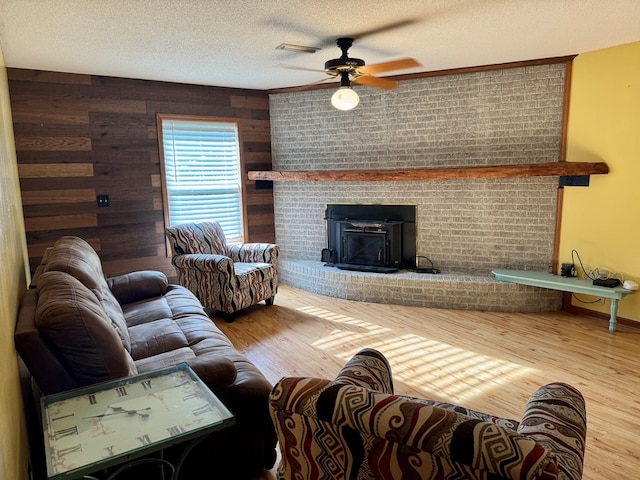 145 Robin Ln, Bainbridge, GA 39819 - living area featuring a ceiling fan, a textured ceiling, wood finished floors, and wooden walls