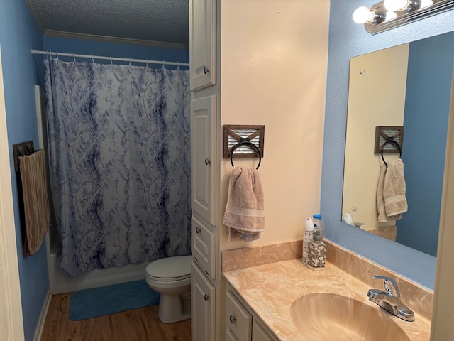 145 Robin Ln, Bainbridge, GA 39819 - bathroom with vanity, wood finished floors, a shower with shower curtain, ornamental molding, and a textured ceiling