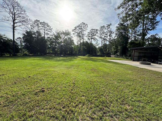 145 Robin Ln, Bainbridge, GA 39819 - view of green lawn featuring a pole building