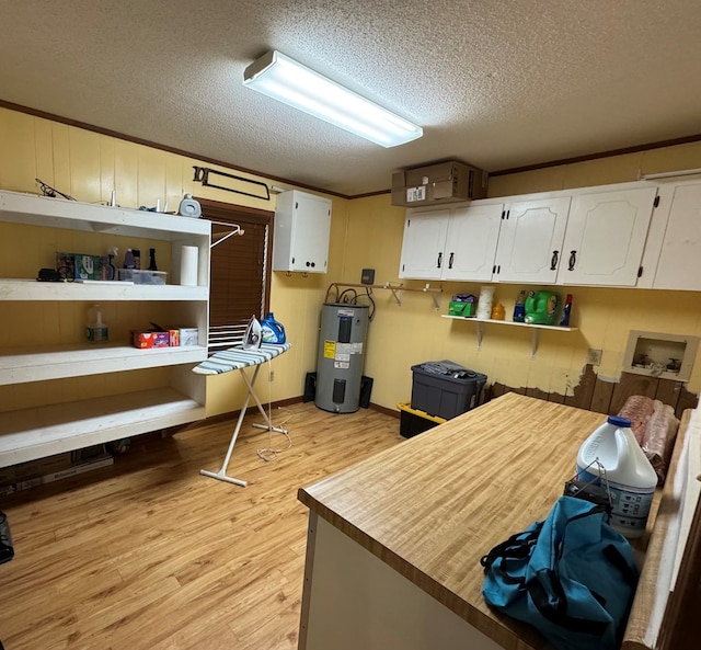 145 Robin Ln, Bainbridge, GA 39819 - office with electric water heater, a textured ceiling, and light wood-style flooring