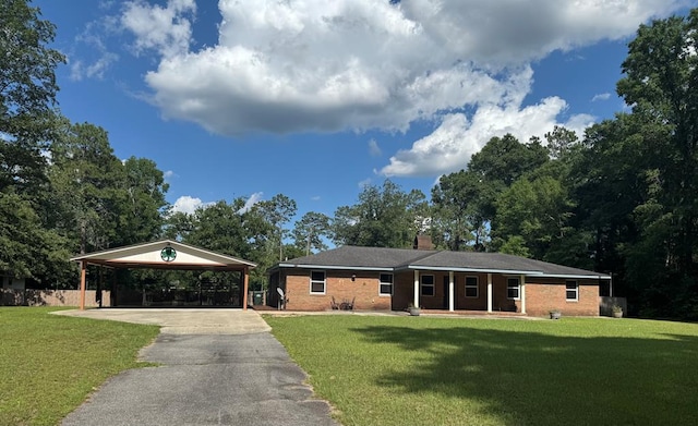 145 Robin Ln, Bainbridge, GA 39819 - ranch-style home with driveway, an attached carport, brick siding, and a chimney