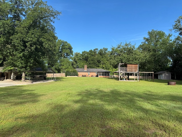 145 Robin Ln, Bainbridge, GA 39819 - view of yard featuring a storage unit