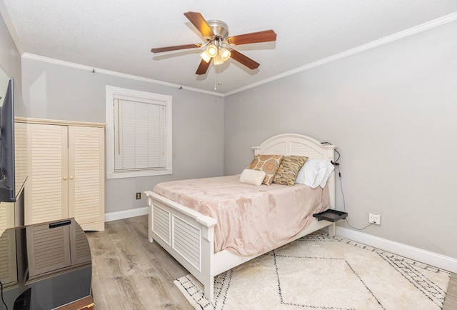 1107 Douglas Dr, Bainbridge, GA 39819 - bedroom featuring baseboards, ornamental molding, light wood-style flooring, and ceiling fan