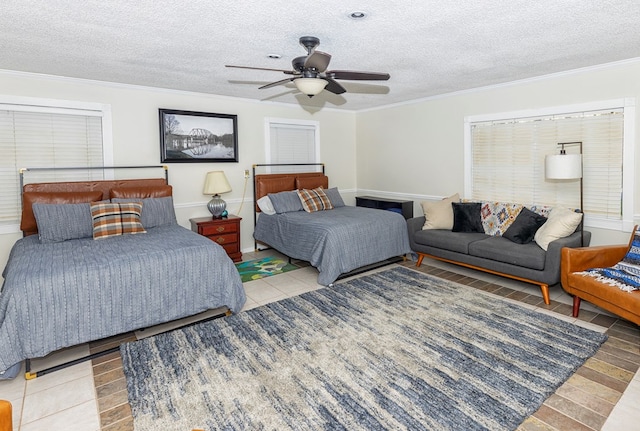 1107 Douglas Dr, Bainbridge, GA 39819 - tiled bedroom with crown molding, a textured ceiling, and ceiling fan