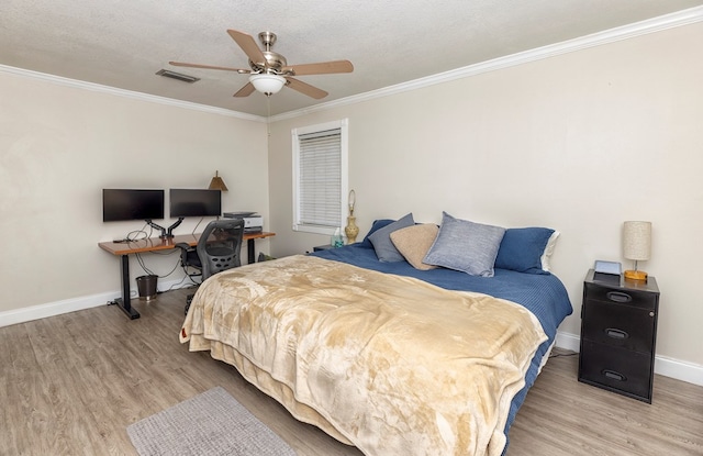 1107 Douglas Dr, Bainbridge, GA 39819 - bedroom with crown molding, wood finished floors, baseboards, and a ceiling fan