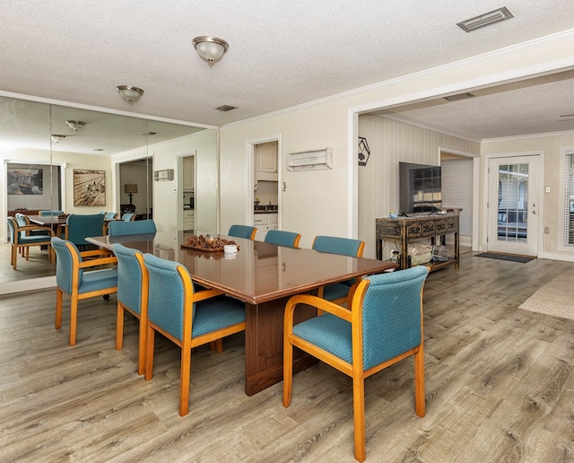 1107 Douglas Dr, Bainbridge, GA 39819 - dining room featuring ornamental molding, wood finished floors, and a textured ceiling