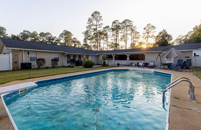 1107 Douglas Dr, Bainbridge, GA 39819 - outdoor pool featuring a patio, cooling unit, and a diving board