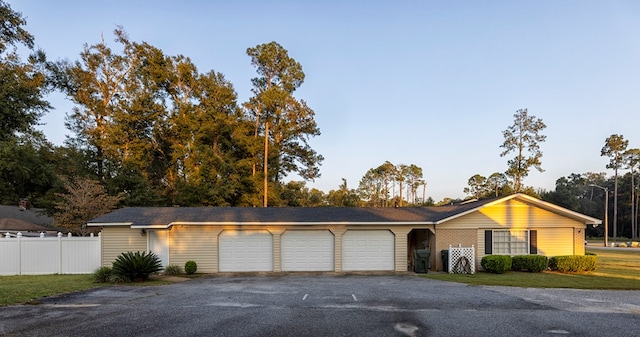 single story home with a garage