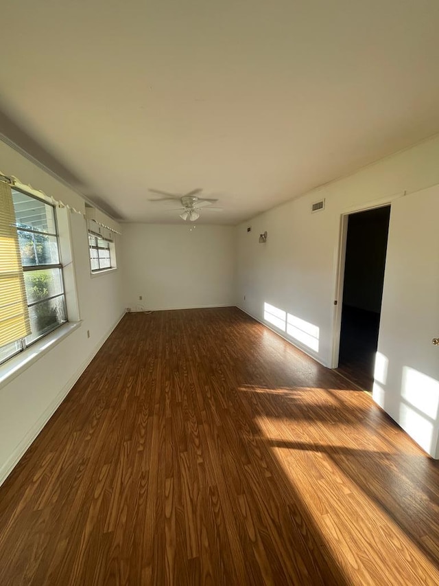 spare room with ceiling fan and hardwood / wood-style flooring