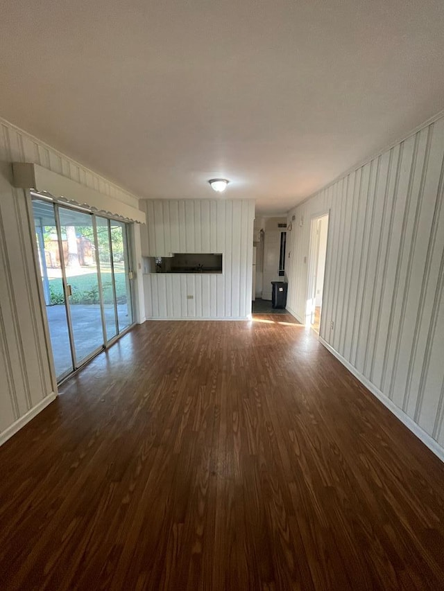 unfurnished living room featuring dark hardwood / wood-style floors