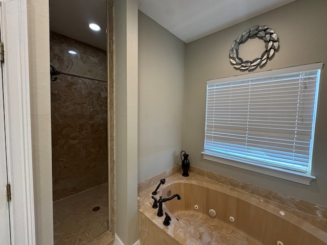 687 River Oaks Dr, Bainbridge, GA 39817 - bathroom featuring a tile shower and a jetted tub
