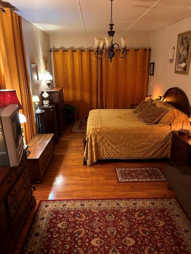 851 Colquitt Hwy, Bainbridge, GA 39817 - bedroom featuring a chandelier and wood finished floors