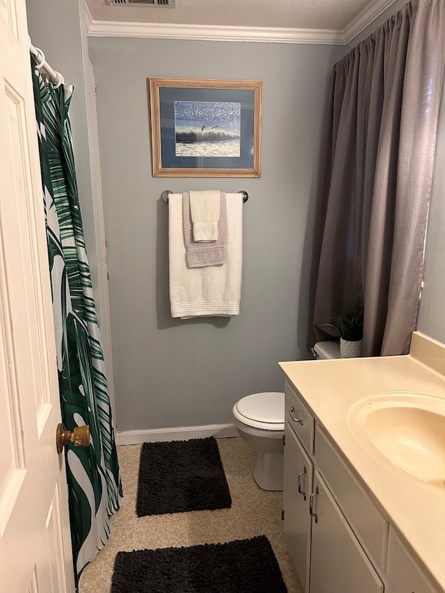 851 Colquitt Hwy, Bainbridge, GA 39817 - full bath featuring vanity, ornamental molding, toilet, baseboards, and a shower with curtain