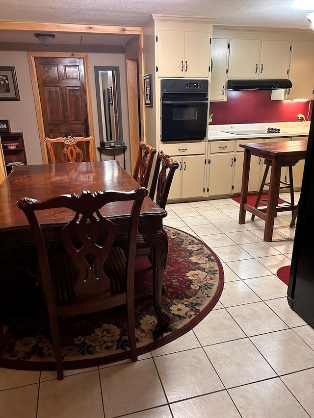 851 Colquitt Hwy, Bainbridge, GA 39817 - dining area with light tile patterned floors and a textured ceiling