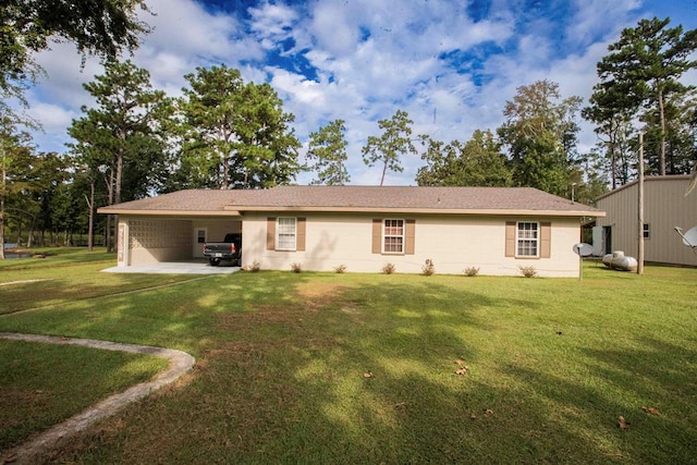 back of property featuring a carport and a yard