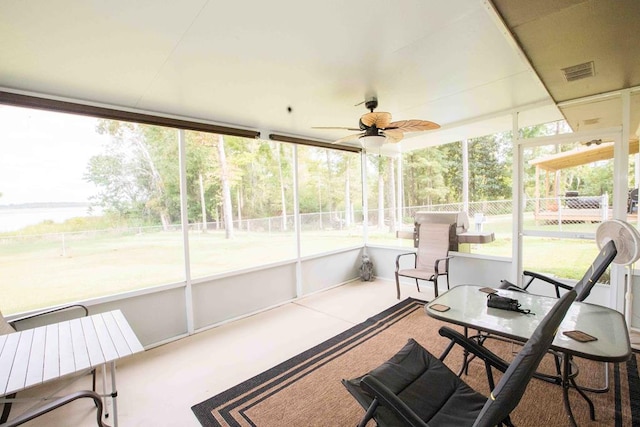 sunroom / solarium with ceiling fan