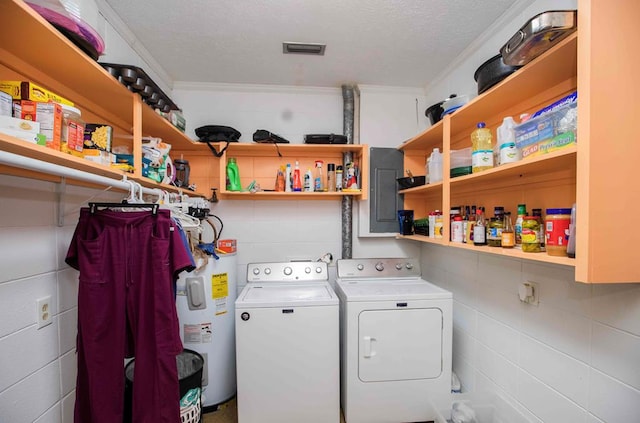 laundry room with electric water heater, electric panel, crown molding, a textured ceiling, and washing machine and clothes dryer