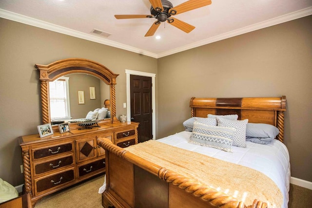 carpeted bedroom featuring ceiling fan and ornamental molding