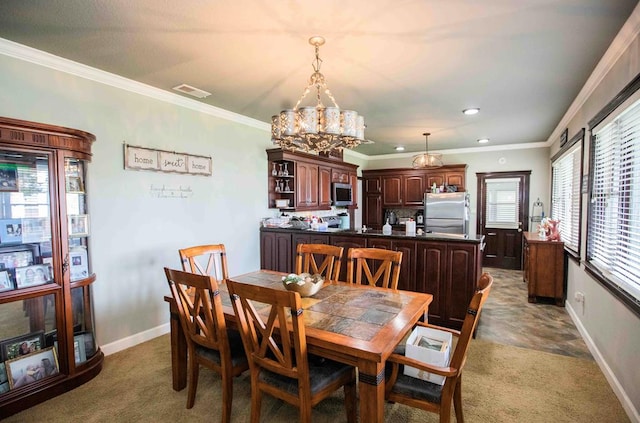 dining space with light colored carpet, ornamental molding, and an inviting chandelier