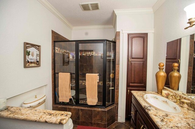 179 Azalea Cir, Bainbridge, GA 39819 - full bathroom with vanity, a shower stall, crown molding, and a textured ceiling