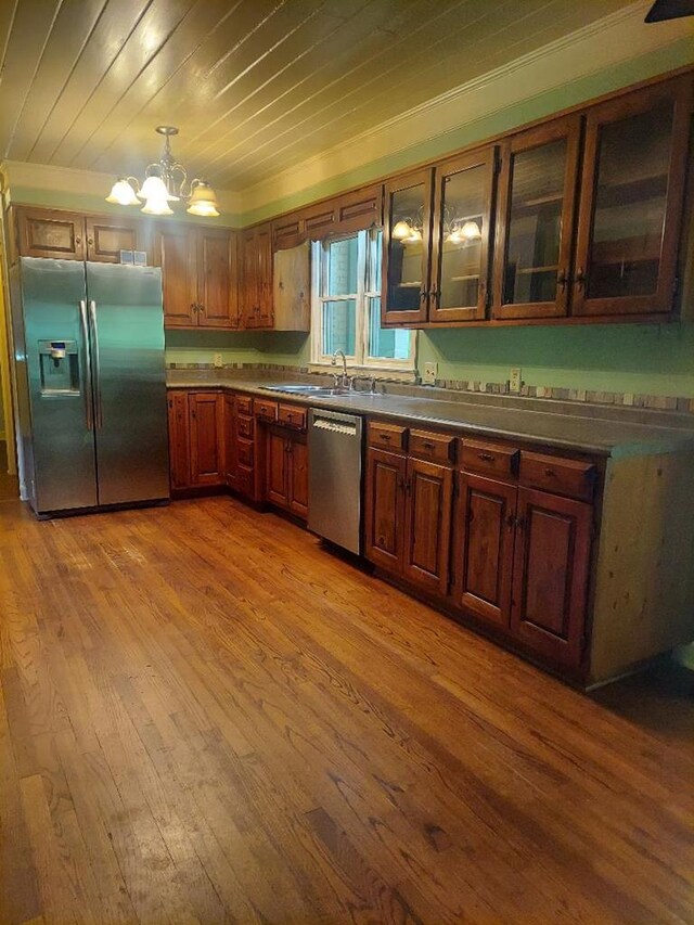 1490 Magnolia Dr, Cairo, GA 39828 - kitchen featuring appliances with stainless steel finishes, wood-type flooring, a chandelier, ornamental molding, and wood ceiling