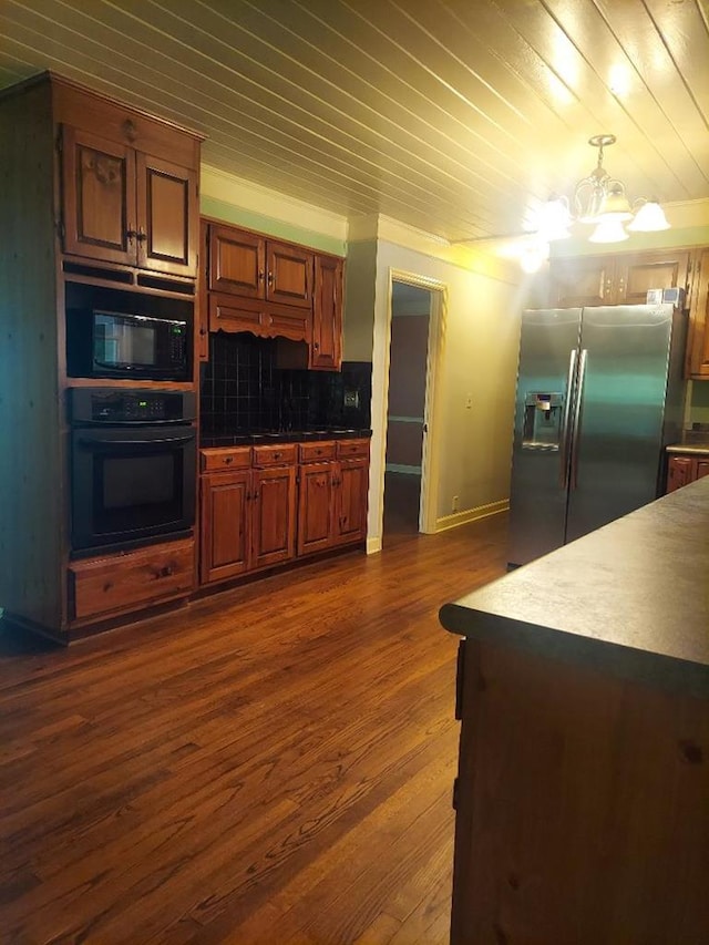 1490 Magnolia Dr, Cairo, GA 39828 - kitchen featuring dark wood-style flooring, an inviting chandelier, wooden ceiling, backsplash, and black appliances