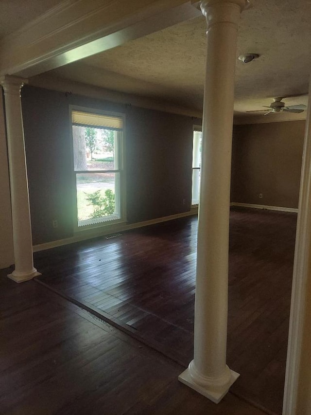 1490 Magnolia Dr, Cairo, GA 39828 - interior space with ornate columns, baseboards, dark wood-style flooring, and ceiling fan