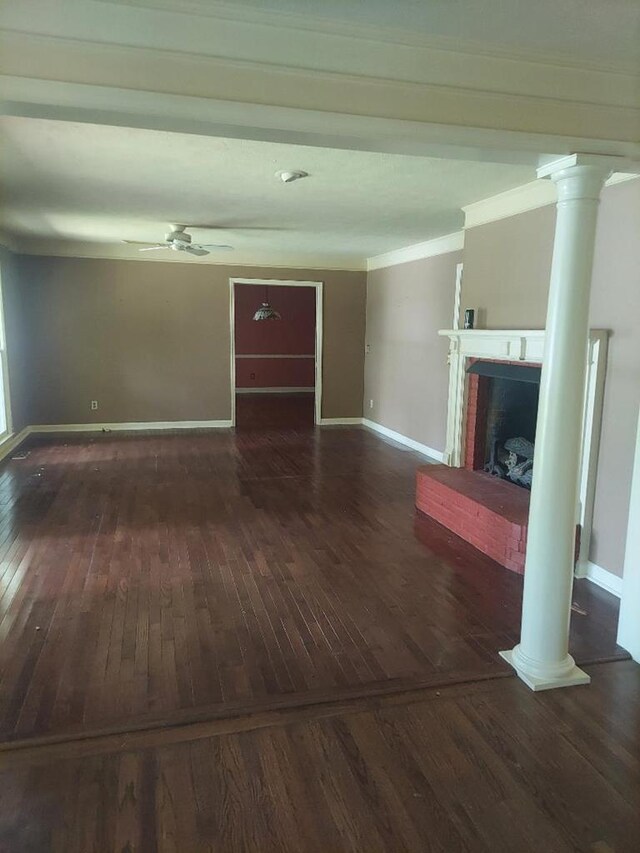 1490 Magnolia Dr, Cairo, GA 39828 - unfurnished living room featuring a fireplace, baseboards, decorative columns, and hardwood / wood-style floors