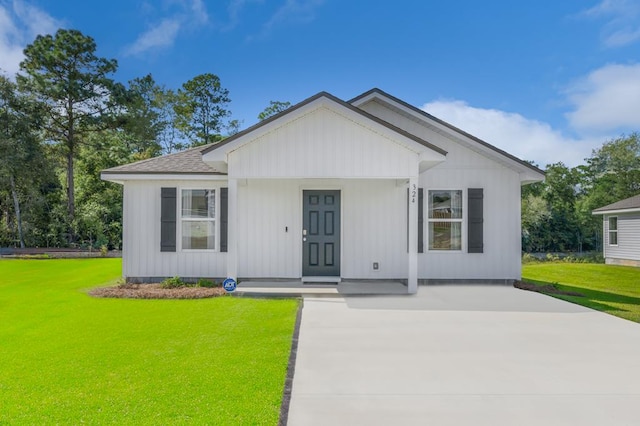 view of front of house with a front yard and a porch