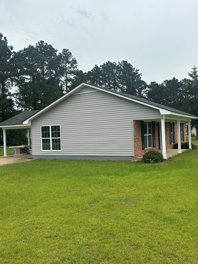 1000 E Gate Dr, Bainbridge, GA 39817 - view of property exterior featuring a yard, a porch, and brick siding